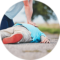 First Aid. Close-up of a person performing CPR on another person.